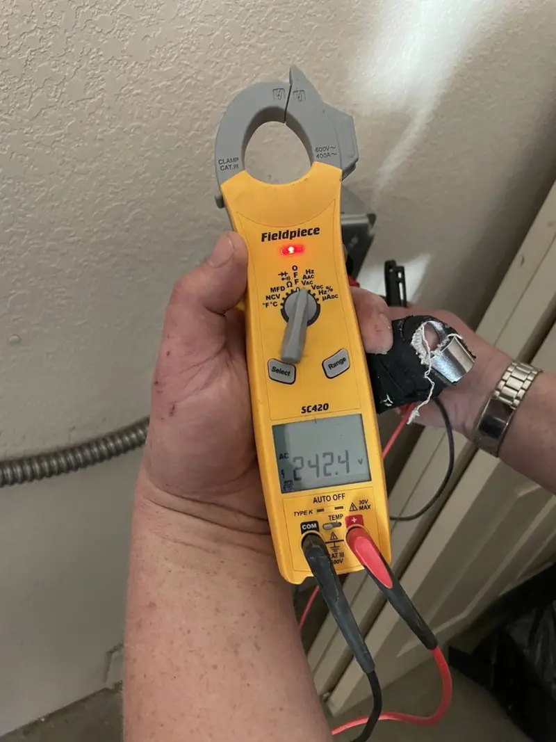 Voltage testing with clamp meter during Circuit Breaker Repair in Warrensburg